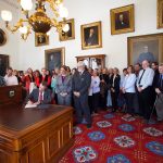 Governor Phil Scott signing the Proclamation.